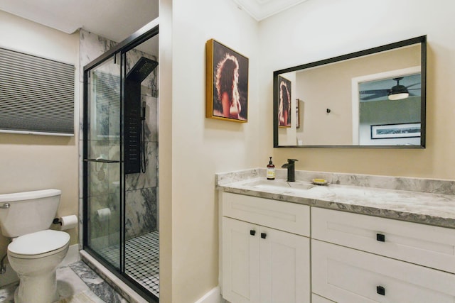 full bath featuring vanity, ceiling fan, a shower stall, and toilet