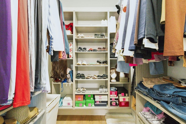 walk in closet featuring light hardwood / wood-style floors