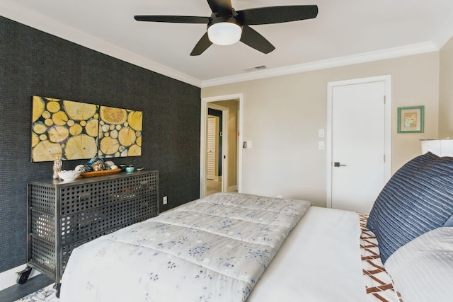 bedroom featuring ceiling fan and ornamental molding