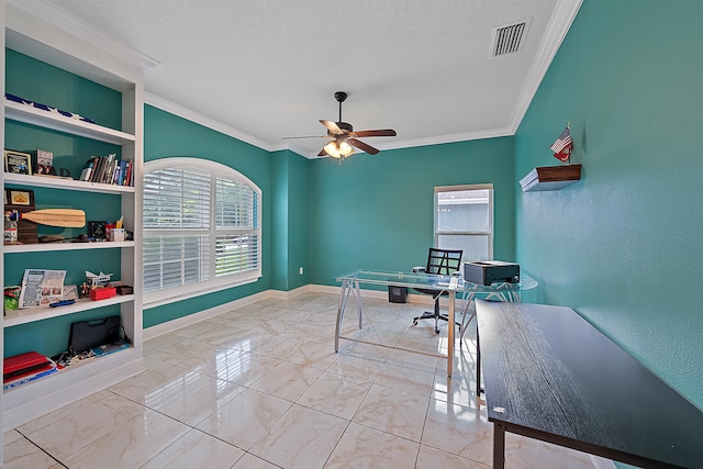 office area featuring ceiling fan, crown molding, a textured ceiling, and built in shelves