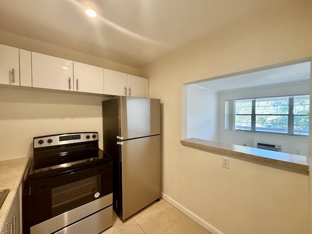 206 Dorchester Unit I, West Palm Beach, FL 33417 - kitchen with appliances with stainless steel finishes, white cabinetry, light tile patterned floors, and light countertops