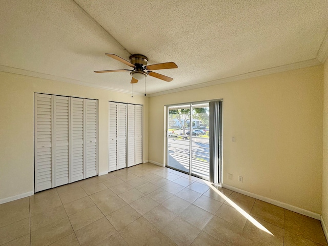 unfurnished bedroom with ornamental molding, ceiling fan, a textured ceiling, light tile patterned floors, and access to outside