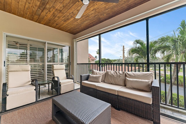 sunroom / solarium with ceiling fan and wooden ceiling