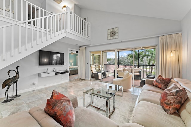 living room featuring high vaulted ceiling