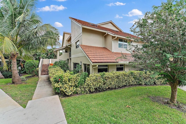 view of property exterior with a yard