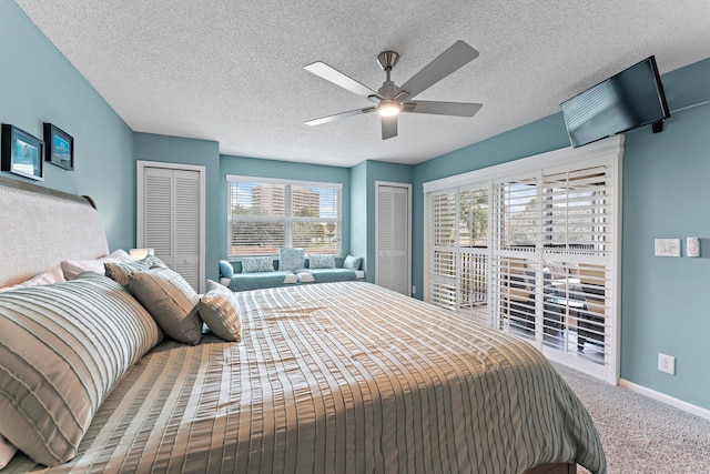 bedroom featuring multiple windows, multiple closets, and ceiling fan