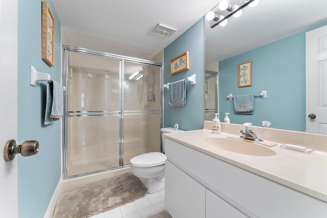 bathroom with tile patterned floors, a shower with door, vanity, and toilet