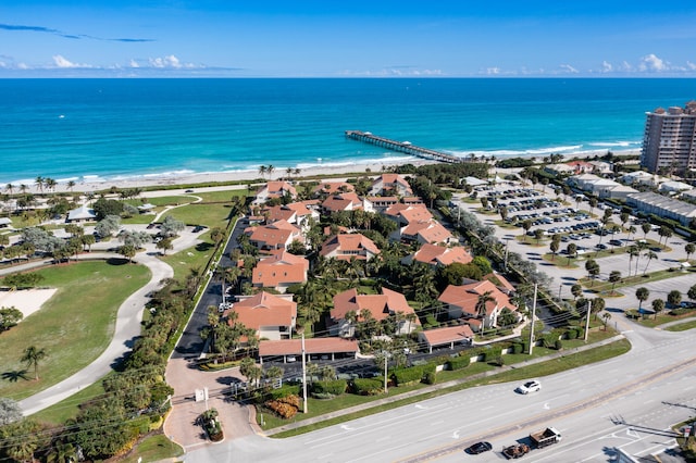 aerial view with a water view and a view of the beach