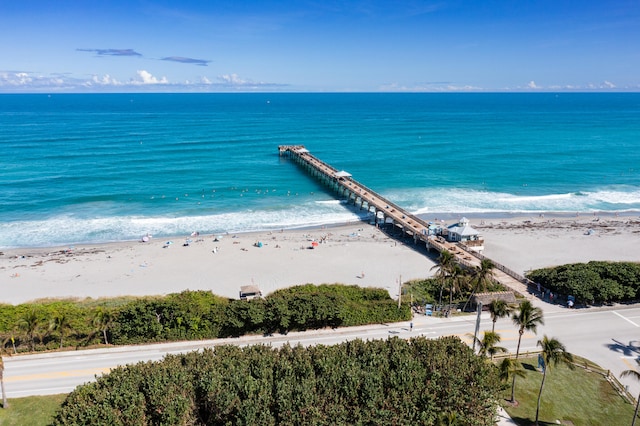 bird's eye view featuring a water view and a view of the beach