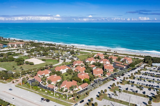 bird's eye view with a water view and a view of the beach