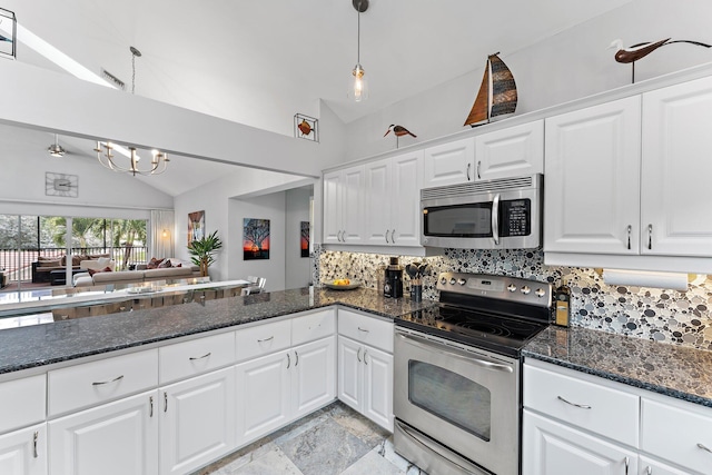 kitchen featuring white cabinets, pendant lighting, and appliances with stainless steel finishes