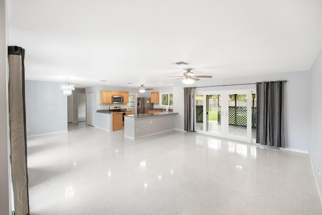 1413 SE San Sovina Ter, Port Saint Lucie, FL 34952 - unfurnished living room with baseboards, a chandelier, and a ceiling fan