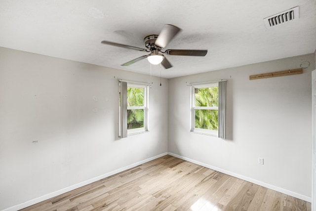 1413 SE San Sovina Ter, Port Saint Lucie, FL 34952 - unfurnished room featuring light wood-type flooring, ceiling fan, and baseboards