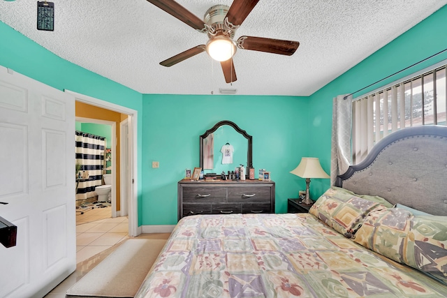 bedroom featuring light tile patterned floors, a textured ceiling, and ceiling fan