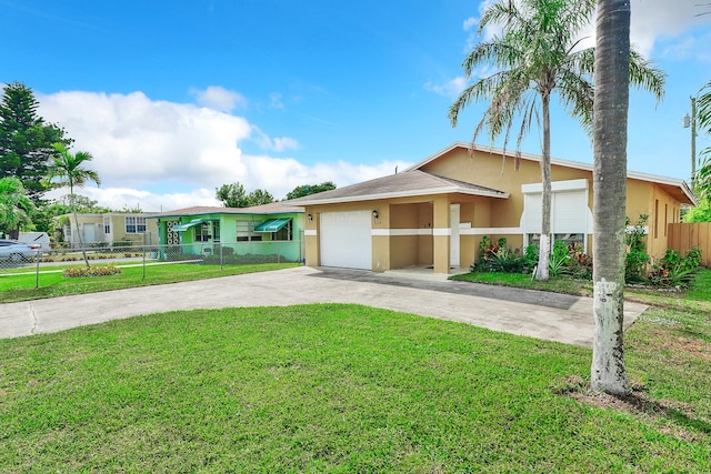 view of front facade with a front lawn and a garage