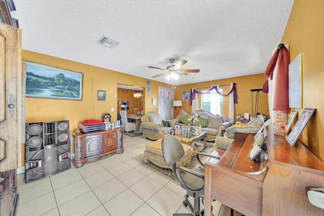 office space with a textured ceiling, light tile patterned floors, and ceiling fan with notable chandelier