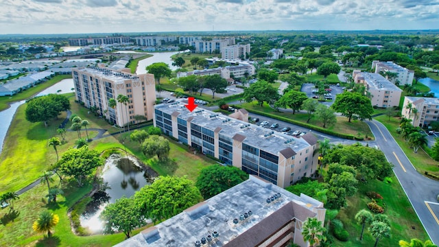 drone / aerial view with a water view