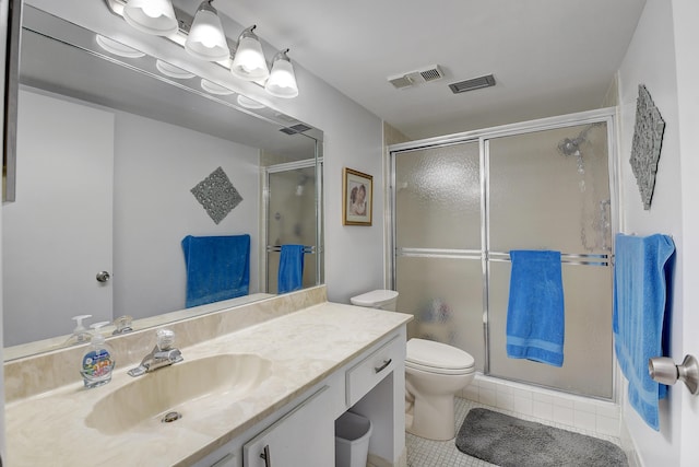 bathroom with walk in shower, vanity, toilet, and tile patterned flooring