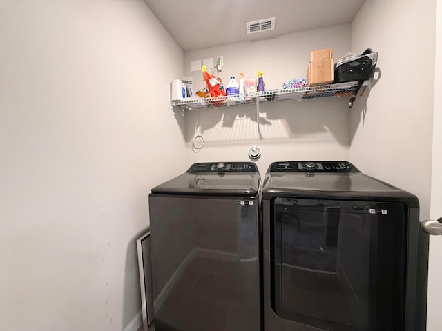 laundry room featuring separate washer and dryer