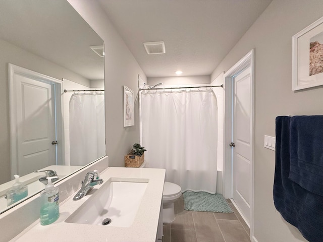 full bathroom with tile patterned flooring, vanity, shower / tub combo with curtain, and toilet