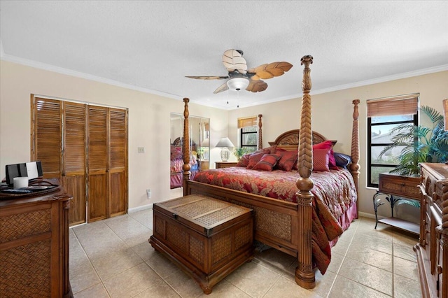 bedroom with ceiling fan, ornamental molding, and a textured ceiling