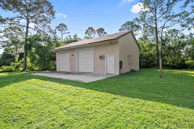 garage with a lawn