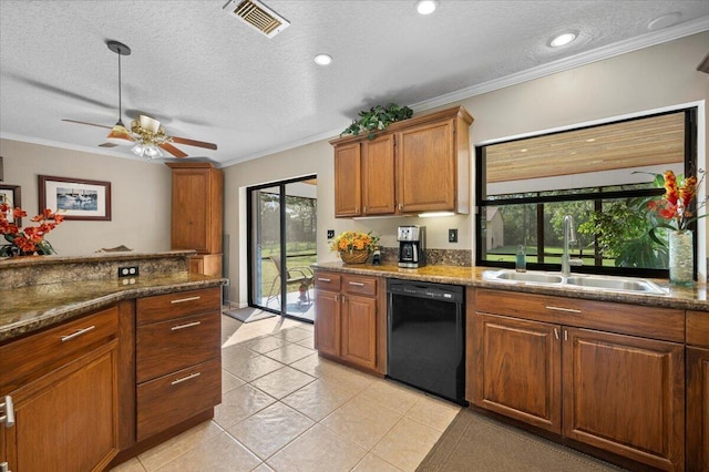 kitchen with a textured ceiling, a healthy amount of sunlight, ornamental molding, and black dishwasher