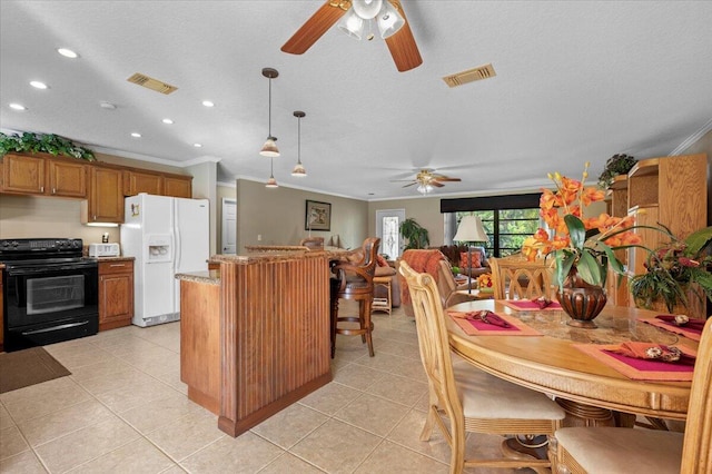 kitchen with crown molding, black electric range oven, pendant lighting, and white refrigerator with ice dispenser