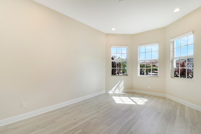 unfurnished room featuring light hardwood / wood-style floors