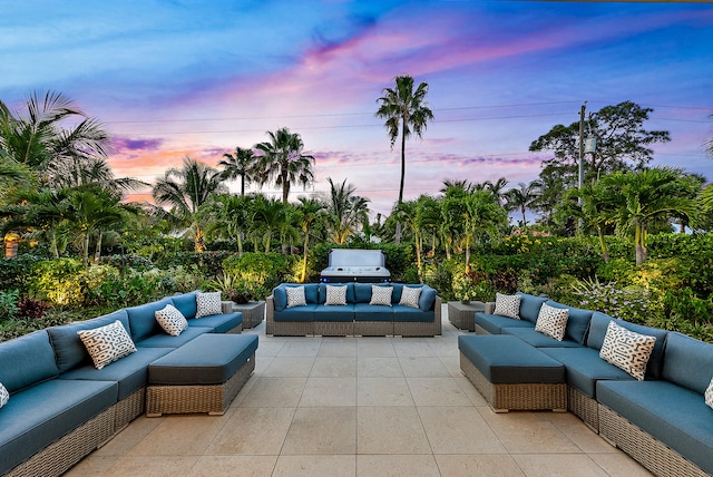 patio terrace at dusk with an outdoor living space