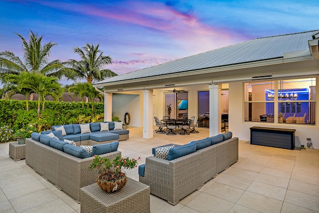 patio terrace at dusk with an outdoor living space