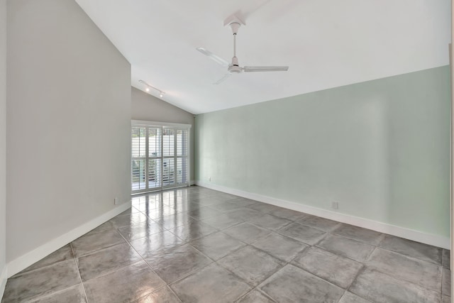 spare room with light tile patterned floors, vaulted ceiling, and ceiling fan