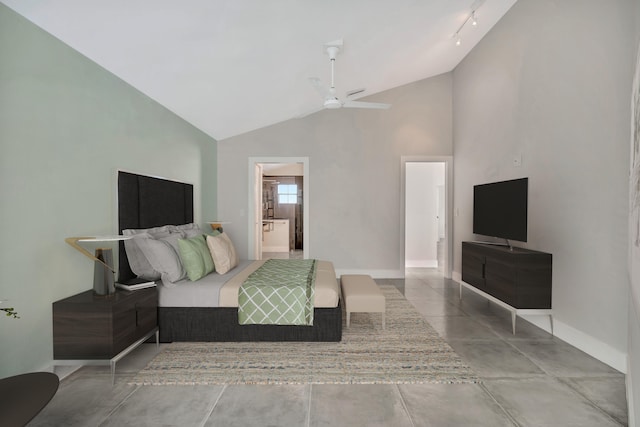 bedroom with ceiling fan, rail lighting, and lofted ceiling