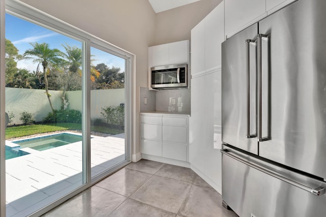 entryway with light tile patterned floors