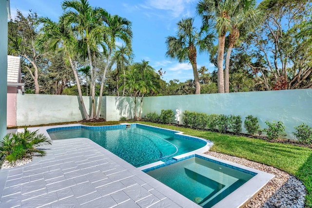 view of swimming pool with an in ground hot tub