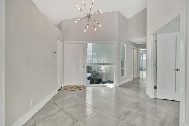 entrance foyer featuring high vaulted ceiling and an inviting chandelier