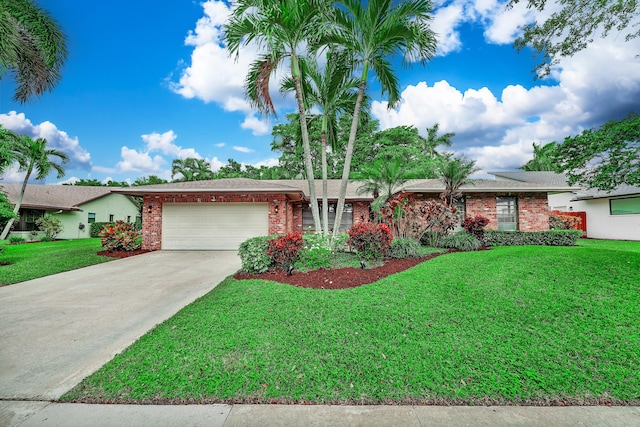 ranch-style house featuring a garage and a front lawn