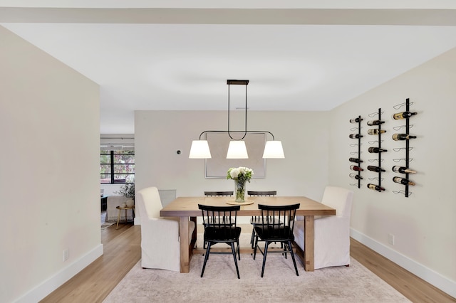 dining area with wood-type flooring