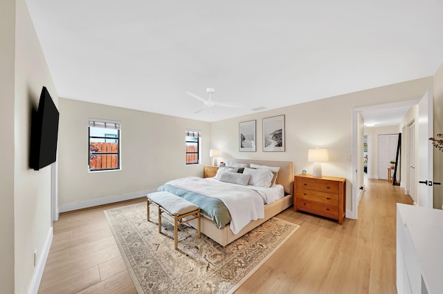 bedroom featuring ceiling fan and light wood-type flooring