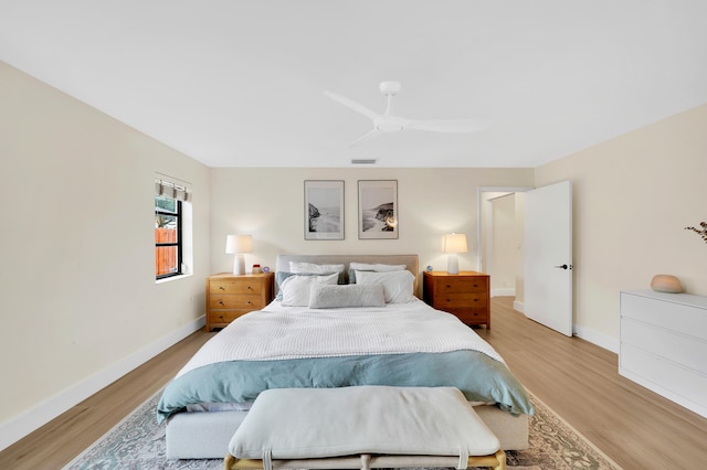 bedroom with ceiling fan and light hardwood / wood-style floors