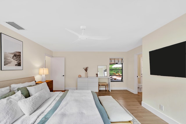 bedroom with light hardwood / wood-style flooring and ceiling fan