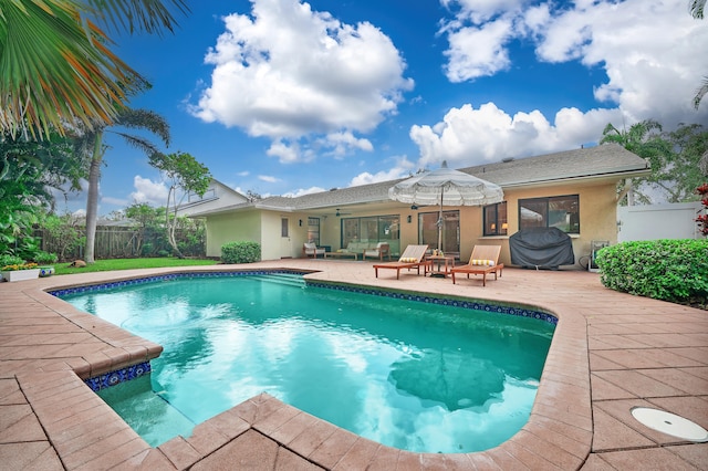 view of pool featuring a patio and ceiling fan