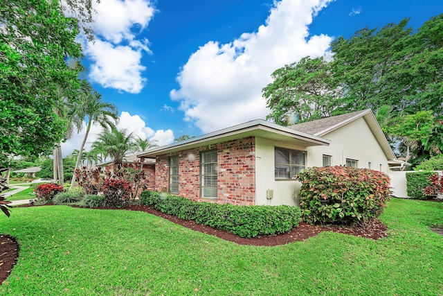 view of property exterior with a yard