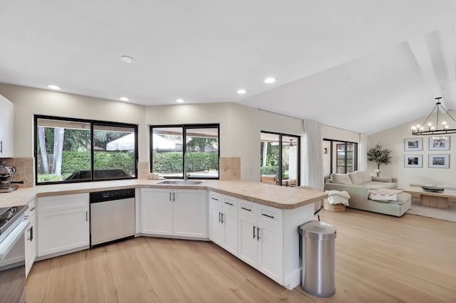 kitchen with light hardwood / wood-style flooring, stainless steel appliances, white cabinetry, and sink