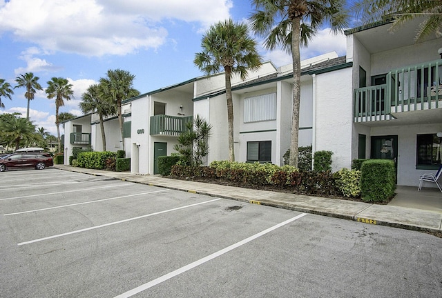 2400 S Ocean Dr Unit 6112, Fort Pierce, FL 34949 - view of building exterior with uncovered parking