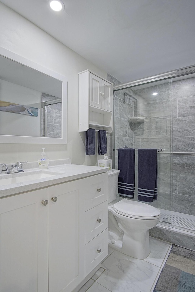 2400 S Ocean Dr Unit 6112, Fort Pierce, FL 34949 - bathroom with toilet, a stall shower, vanity, and marble finish floors