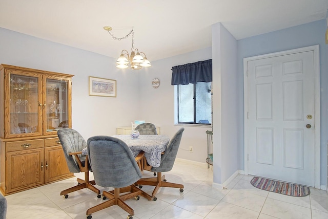 2400 S Ocean Dr Unit 6112, Fort Pierce, FL 34949 - dining room with an office area, a chandelier, and baseboards