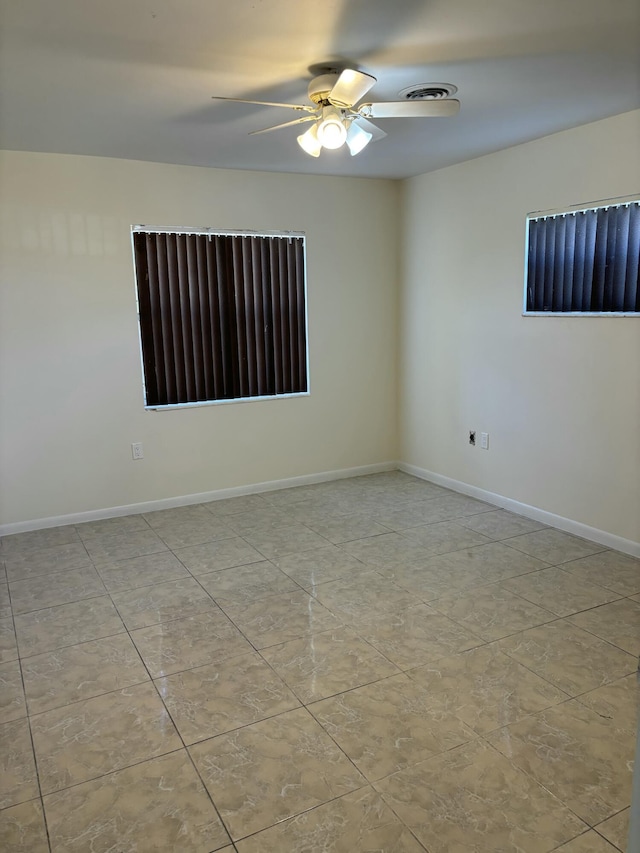 empty room featuring ceiling fan