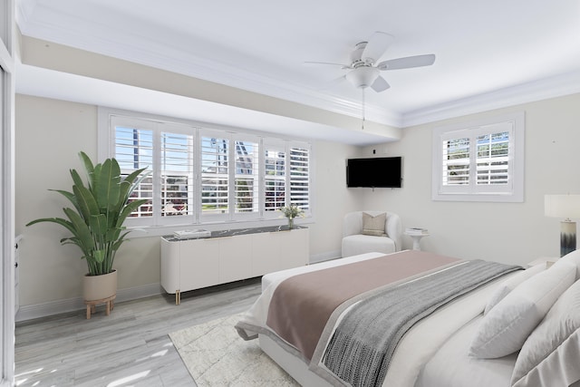 bedroom featuring ceiling fan, light hardwood / wood-style floors, and ornamental molding