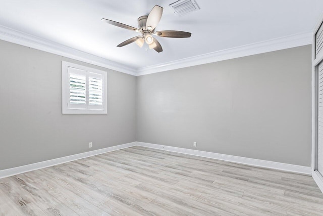 spare room featuring light hardwood / wood-style flooring, ceiling fan, and ornamental molding